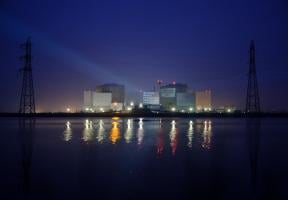 Photo of a night-time demonstration organized by Greenpeace in front of the Fessenheim nuclear power plant in Alsace.